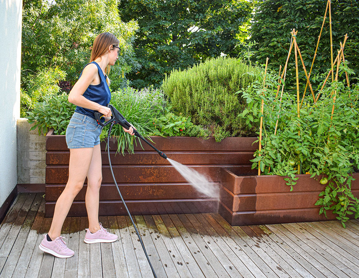 Professional pressure cleaning service removing dirt from outdoor surfaces